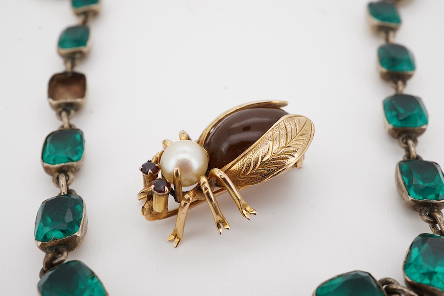 A 14k, cultured pearl, garnet and cabochon stone set bug brooch, 24mm, gross weight 3.4 grams, together with an antique gilt metal and paste set necklace (stones missing), 35cm. Condition - poor and good